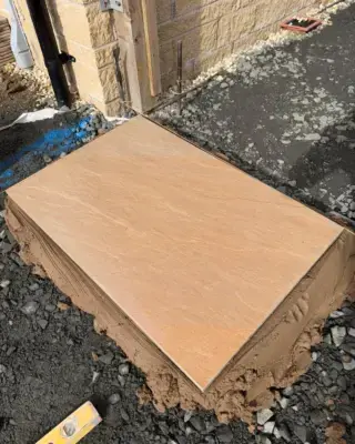 Brand-new Veda Stone sandstone/porcelain tiles going down at our Newton Farm project 😮‍💨👌